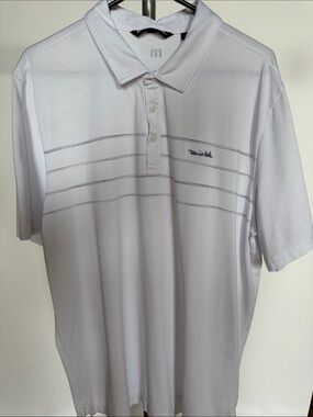 Travis Mathew White Short-Sleeve Performance Polo with Subtle Stripe Detail